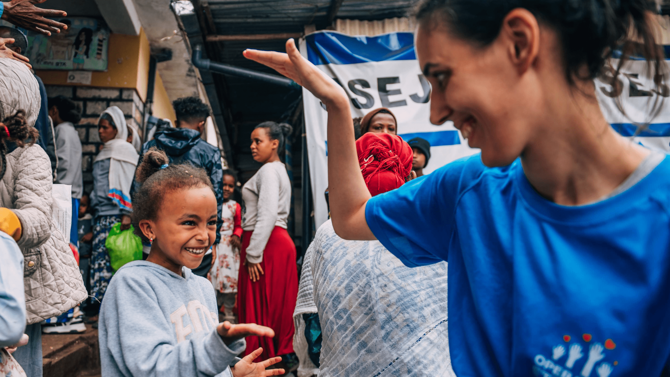 get-involved-min operation ethiopia volunteer with little girl
